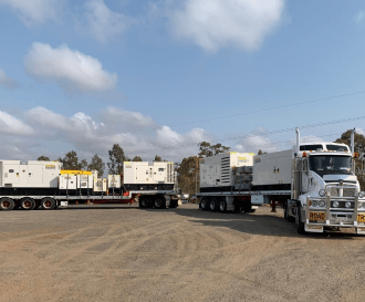 A truck with generators is heading off for delivery