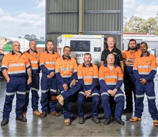 Total Generators' Team in front of generator