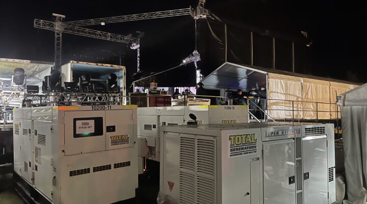 Generators backstage at an outdoor music event.